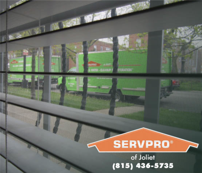 SERVPRO trucks through a window.