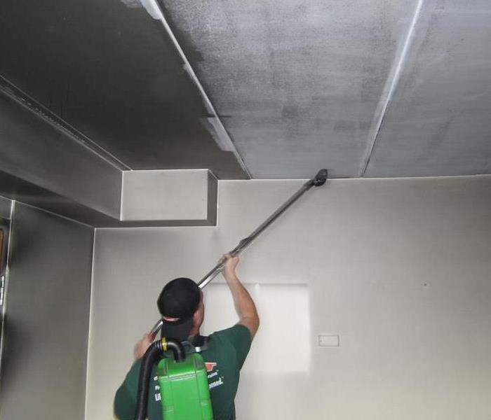 Hepa Vacuum Cleaning a sooted up ceiling