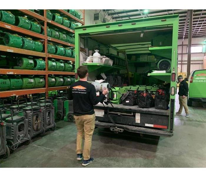 SERVPRO technician with a stocked truck with drying equipment